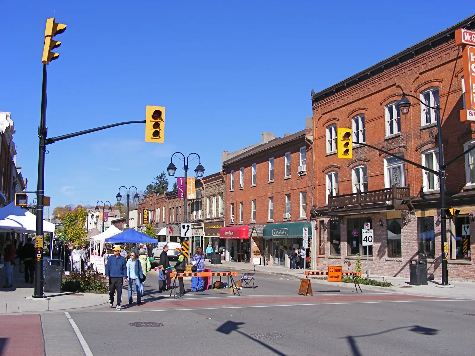 A heritage streetscape of century homes along Main Street in downtown Georgetown, Ontario